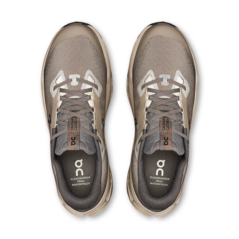 On Men's Cloudsurfer Trail 2 Waterproof Running Shoes in Cinder/Desert AW25 running in an overpass area shoes maximalist